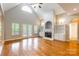 Bright living room with a vaulted ceiling, fireplace, and built-in cabinets, perfect for entertaining at 132 Homeplace Ln, Statesville, NC 28625