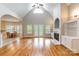 Spacious living room features high ceilings, a fireplace, and views to the outside at 132 Homeplace Ln, Statesville, NC 28625