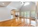 Open-concept living room flows into the dining area, featuring hardwood floors and a fireplace at 132 Homeplace Ln, Statesville, NC 28625