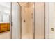 Bathroom with shower featuring glass doors, tile, and updated fixtures at 132 Homeplace Ln, Statesville, NC 28625