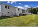 Townhome backyard with patio, green grass and white privacy fence at 149 Briana Marie Way, Indian Trail, NC 28079