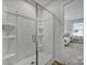 Clean bathroom with a glass-enclosed shower and view into the bedroom at 149 Briana Marie Way, Indian Trail, NC 28079