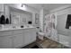 Modern bathroom with double vanity, neutral colors, and tub-shower combo at 149 Briana Marie Way, Indian Trail, NC 28079