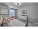 Bright bedroom with daybed, dresser, and large window with natural light at 149 Briana Marie Way, Indian Trail, NC 28079