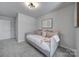 Cozy bedroom featuring a daybed with decorative pillows and carpeted floor at 149 Briana Marie Way, Indian Trail, NC 28079