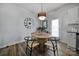 Cozy dining area features a stylish table, modern chairs, and a decorative pendant light at 149 Briana Marie Way, Indian Trail, NC 28079