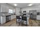 Modern kitchen with stainless steel appliances, granite countertops, and a center island at 149 Briana Marie Way, Indian Trail, NC 28079