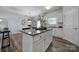 Spacious kitchen featuring a large island with granite countertops and stainless-steel appliances at 149 Briana Marie Way, Indian Trail, NC 28079