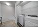 Convenient laundry room with modern washer, dryer, and storage shelves at 149 Briana Marie Way, Indian Trail, NC 28079