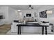 Bright living room featuring modern furnishings, sleek ceiling fan, and stylish decor at 149 Briana Marie Way, Indian Trail, NC 28079