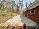 Spacious backyard featuring a concrete patio, garden, and a well-maintained lawn at 1525 16Th Avenue Nw Cir, Hickory, NC 28601