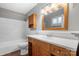 Cozy bathroom featuring a vanity with drawers and marble-tiled shower and bathtub combination at 1525 16Th Avenue Nw Cir, Hickory, NC 28601