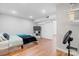 Well-lit bedroom featuring hardwood floors, a TV, and ample storage space at 1525 16Th Avenue Nw Cir, Hickory, NC 28601