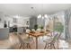 Staged dining room with modern table setting and ample natural light, open to the updated kitchen at 1525 16Th Avenue Nw Cir, Hickory, NC 28601