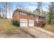 Charming two-story brick home with a two-car garage and meticulously kept front lawn at 1525 16Th Avenue Nw Cir, Hickory, NC 28601