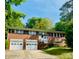 Charming brick home with a two-car garage and beautifully landscaped front yard, offering great curb appeal at 1525 16Th Avenue Nw Cir, Hickory, NC 28601