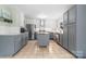 Bright, updated kitchen featuring stainless steel appliances, a kitchen island, and stylish gray and white cabinetry at 1525 16Th Avenue Nw Cir, Hickory, NC 28601