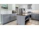 Well-lit kitchen offers stainless steel appliances, center island, and modern design, creating a culinary haven at 1525 16Th Avenue Nw Cir, Hickory, NC 28601