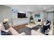 Bright living room featuring white sofas, a gray rug, and a built-in entertainment center at 1525 16Th Avenue Nw Cir, Hickory, NC 28601