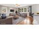 Comfortable living room with hardwood floors, ample seating, and a large window, creating a cozy atmosphere at 1525 16Th Avenue Nw Cir, Hickory, NC 28601