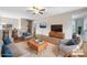 Inviting living room featuring hardwood floors, comfortable seating, and an open layout, perfect for entertaining at 1525 16Th Avenue Nw Cir, Hickory, NC 28601
