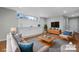 Bright living room area with wood floors, gray area rug and a built-in storage/entertainment center at 1525 16Th Avenue Nw Cir, Hickory, NC 28601