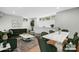 Open-concept living room with adjacent dining area and modern decor, including marble dining table at 1525 16Th Avenue Nw Cir, Hickory, NC 28601