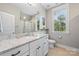 Bathroom with granite countertop, white cabinetry, and a shower-tub combination at 1620 Arnold Dr, Charlotte, NC 28205