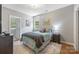Cozy bedroom featuring a comfy bed with a plush rug and natural light from a window at 1620 Arnold Dr, Charlotte, NC 28205