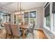 Dining room featuring a wood table, chandelier, natural light, and neutral décor at 1620 Arnold Dr, Charlotte, NC 28205