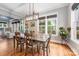 Bright dining room with wood flooring, large windows and modern lighting open to Gathering room at 1620 Arnold Dr, Charlotte, NC 28205