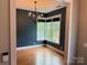 This dining room features hardwood floors, elegant chandelier and large windows for lots of natural light at 1620 Arnold Dr, Charlotte, NC 28205