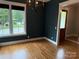 Dining Room with hardwood floors, dark walls, and large windows that provide lots of natural light at 1620 Arnold Dr, Charlotte, NC 28205