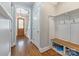 Welcoming entryway with hardwood floors, coat rack, and view of the wooden front door at 1620 Arnold Dr, Charlotte, NC 28205