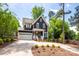 Beautiful two-story home with a two-car garage and a well-manicured lawn at 1620 Arnold Dr, Charlotte, NC 28205