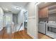Upper hallway featuring hardwood floors, utility room and staircase to the lower level at 1620 Arnold Dr, Charlotte, NC 28205