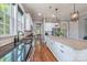 Gourmet kitchen with white cabinets, granite countertops, stainless steel appliances, and eat-in kitchen island at 1620 Arnold Dr, Charlotte, NC 28205