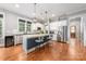 Modern kitchen with stainless steel appliances, a center island, and hardwood floors at 1620 Arnold Dr, Charlotte, NC 28205