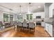 Kitchen featuring an island with seating, pendant lights, and stainless steel appliances, open to the dining area at 1620 Arnold Dr, Charlotte, NC 28205
