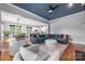 Open floor plan living room with hardwood floors, and open to kitchen and dining area at 1620 Arnold Dr, Charlotte, NC 28205