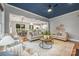 Open-concept living room showcasing hardwood floors, stylish furniture, and seamless flow into the dining area and kitchen at 1620 Arnold Dr, Charlotte, NC 28205