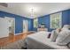 Comfortable main bedroom featuring hardwood floors, windows, and access to the main bathroom at 1620 Arnold Dr, Charlotte, NC 28205