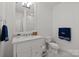 Clean, bright bathroom with a marble countertop, tile floor, and a glass door shower at 1625 Bibury Ln, Charlotte, NC 28211