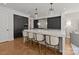 Eat-in kitchen with marble countertops, pendant lighting, and stainless steel appliances at 1625 Bibury Ln, Charlotte, NC 28211