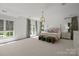 Bright main bedroom with a decorative ceiling fan, hardwood floors and bright natural light at 1625 Bibury Ln, Charlotte, NC 28211