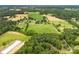 Wide aerial perspective showcasing a large, rural property with a variety of landscapes at 16453 Nc Hwy 73 Hwy, Albemarle, NC 28001