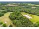 Expansive aerial view of a lush, green property with trees and open land at 16453 Nc Hwy 73 Hwy, Albemarle, NC 28001
