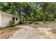 The expansive backyard features lush greenery, mature trees, and outdoor spaces for relaxation and recreation at 16453 Nc Hwy 73 Hwy, Albemarle, NC 28001