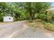 The expansive backyard features lush greenery, mature trees, and outdoor spaces for relaxation and recreation at 16453 Nc Hwy 73 Hwy, Albemarle, NC 28001