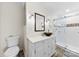 A renovated bathroom features a mosaic tiled floor, vanity sink and tiled shower at 16453 Nc Hwy 73 Hwy, Albemarle, NC 28001